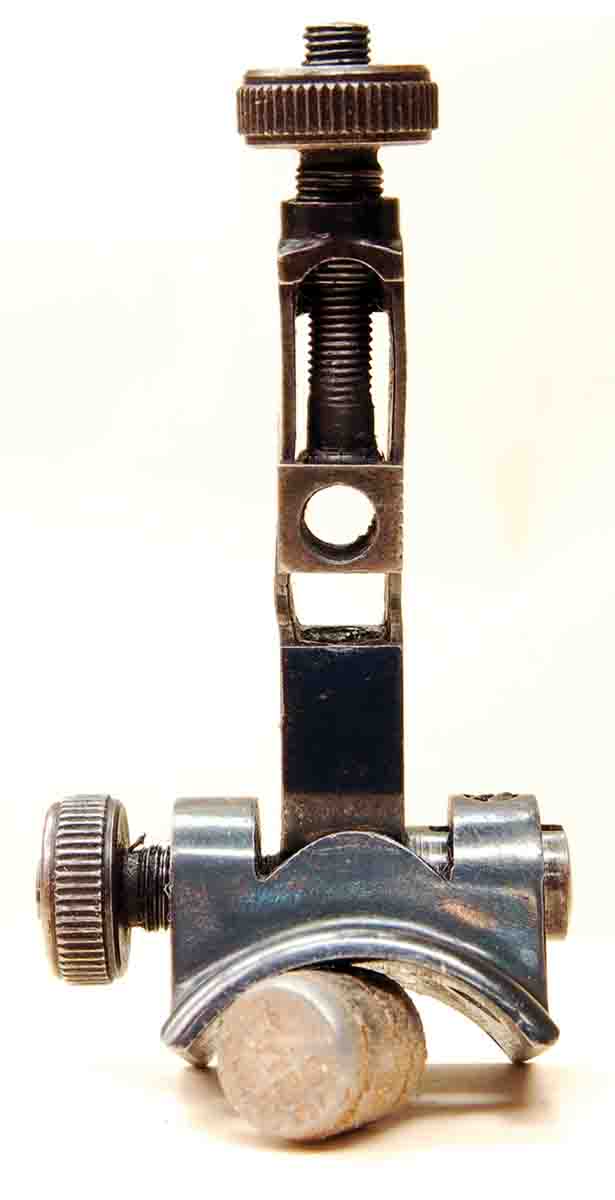 This BSA tang sight for a Martini .22 target rifle has been damaged by dropping the gun, bending the thin sidewalls and preventing elevation adjustments.